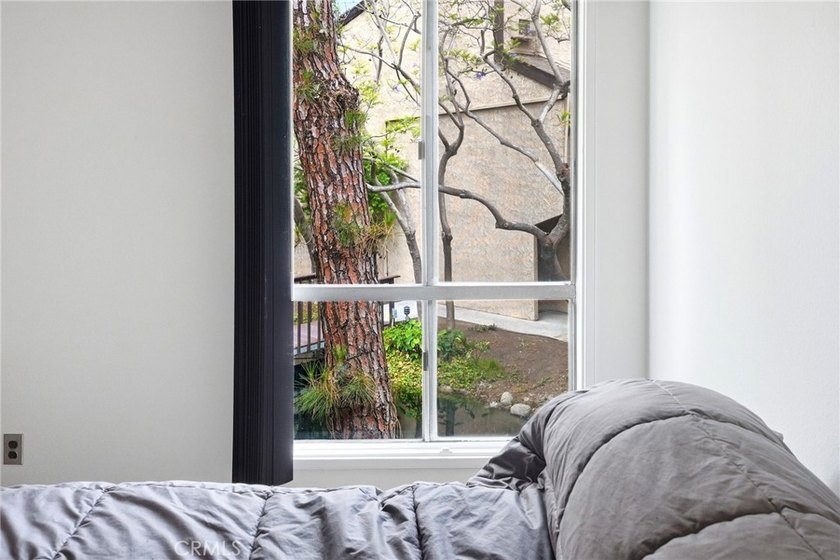 Welcome to this upper-level 2-bedroom, 2-bath condo offering 1 - photo 32