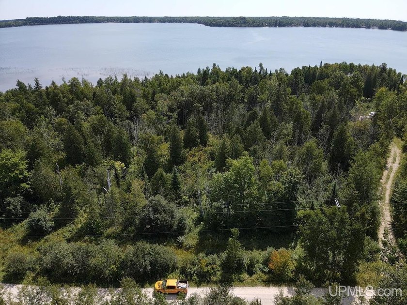 This large parcel sits on the north shore of Gulliver Lake and - photo 2