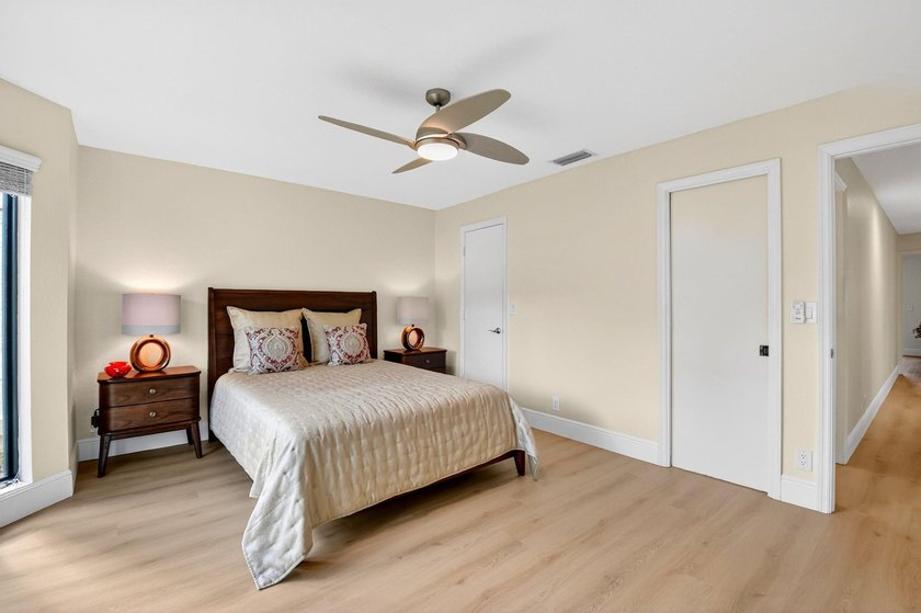 STUNNING LAKESIDE RENOVATION! 1st-floor condo offers expansive - photo 12