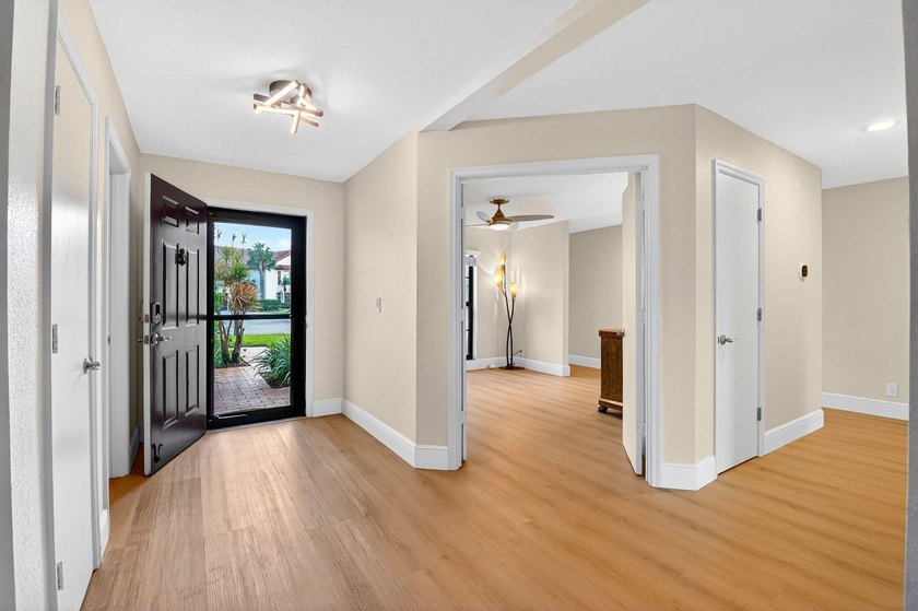 STUNNING LAKESIDE RENOVATION! 1st-floor condo offers expansive - photo 16