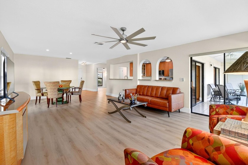 STUNNING LAKESIDE RENOVATION! 1st-floor condo offers expansive - photo 21