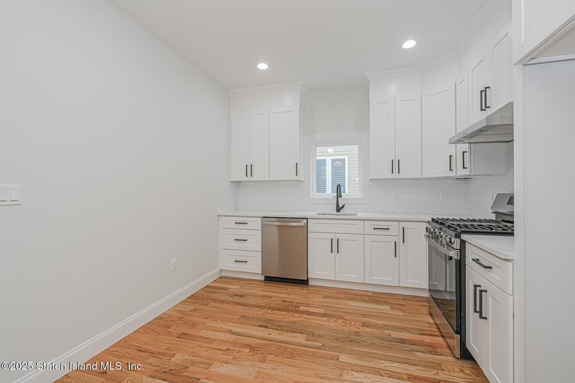 NEW CONSTRUCTION! Beautiful TWO family custom 6 over 6 home - photo 15