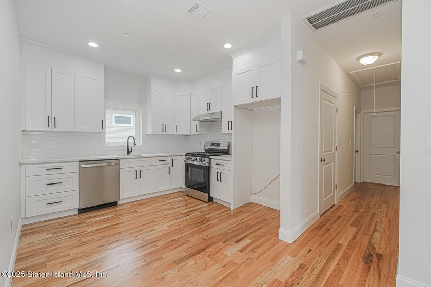 NEW CONSTRUCTION! Beautiful TWO family custom 6 over 6 home - photo 41