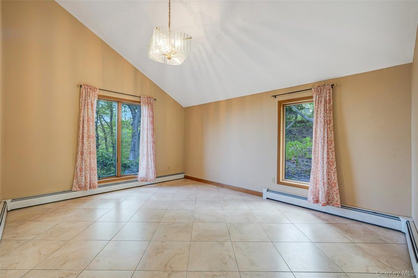 Set within the quiet Rolling Woods neighborhood on a shy acre at - photo 19