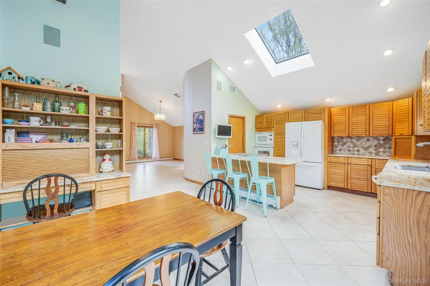 Set within the quiet Rolling Woods neighborhood on a shy acre at - photo 24