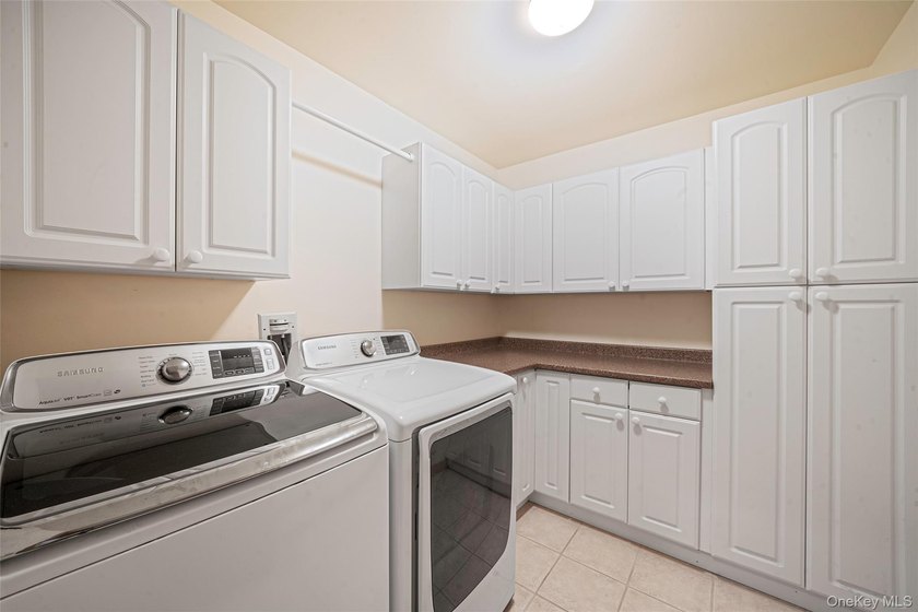 Set within the quiet Rolling Woods neighborhood on a shy acre at - photo 28