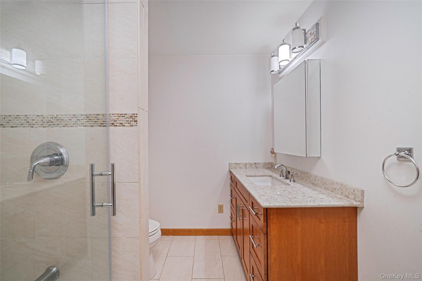 Set within the quiet Rolling Woods neighborhood on a shy acre at - photo 30