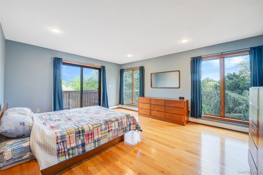 Set within the quiet Rolling Woods neighborhood on a shy acre at - photo 32