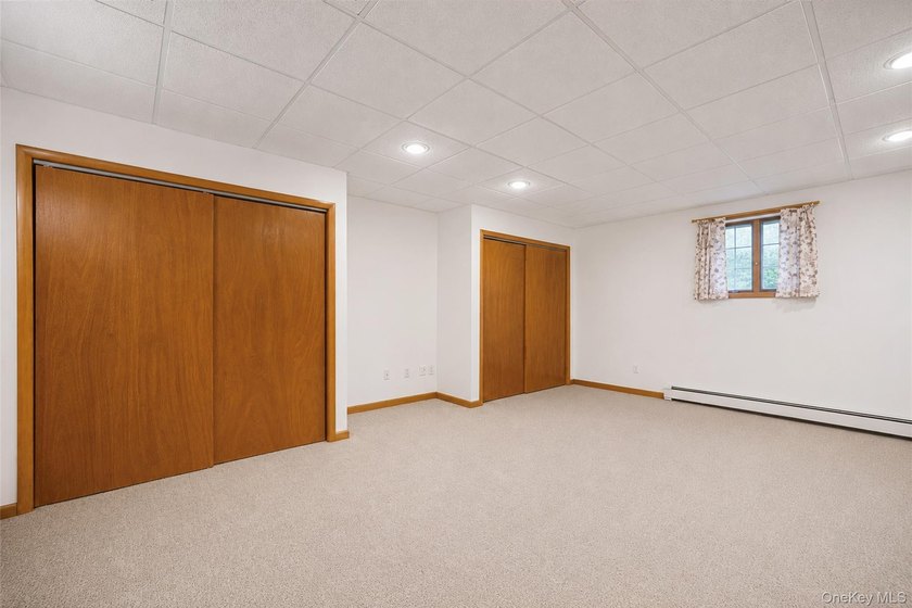 Set within the quiet Rolling Woods neighborhood on a shy acre at - photo 37