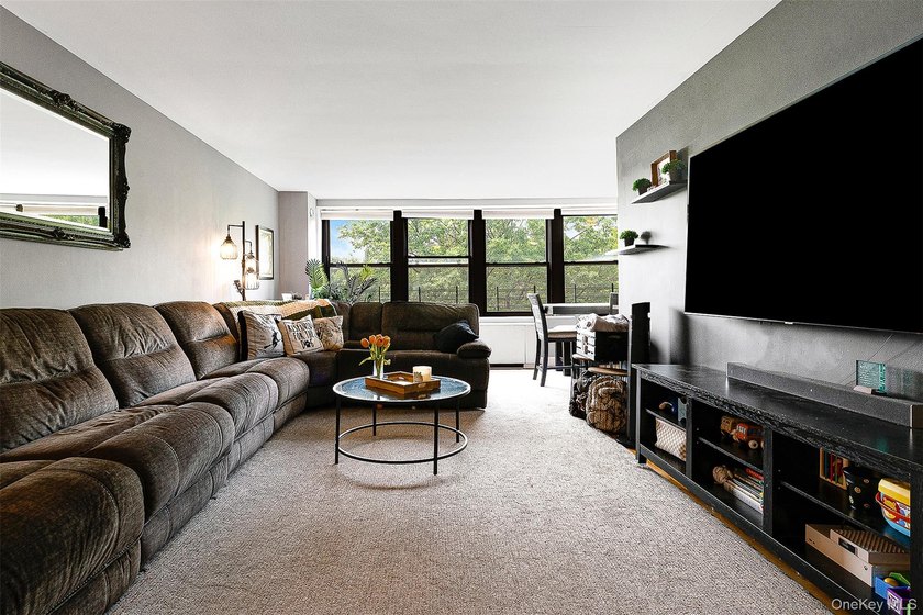 Welcome to this sprawling 3-bedroom, 2-bathroom corner unit in - photo 6