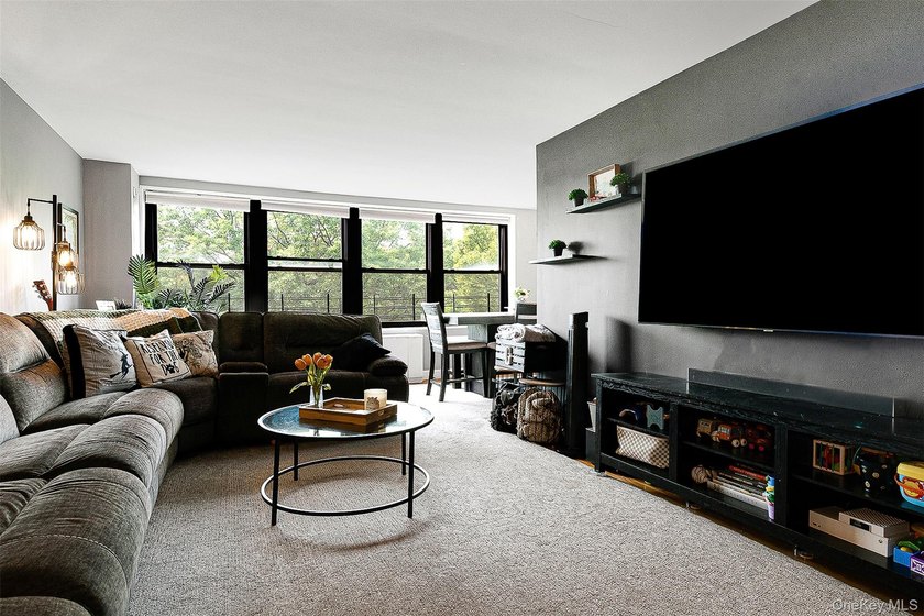 Welcome to this sprawling 3-bedroom, 2-bathroom corner unit in - photo 8