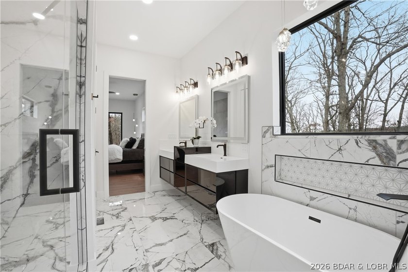 Welcome to your new modern retreat in Porto Cima. This stunning - photo 13