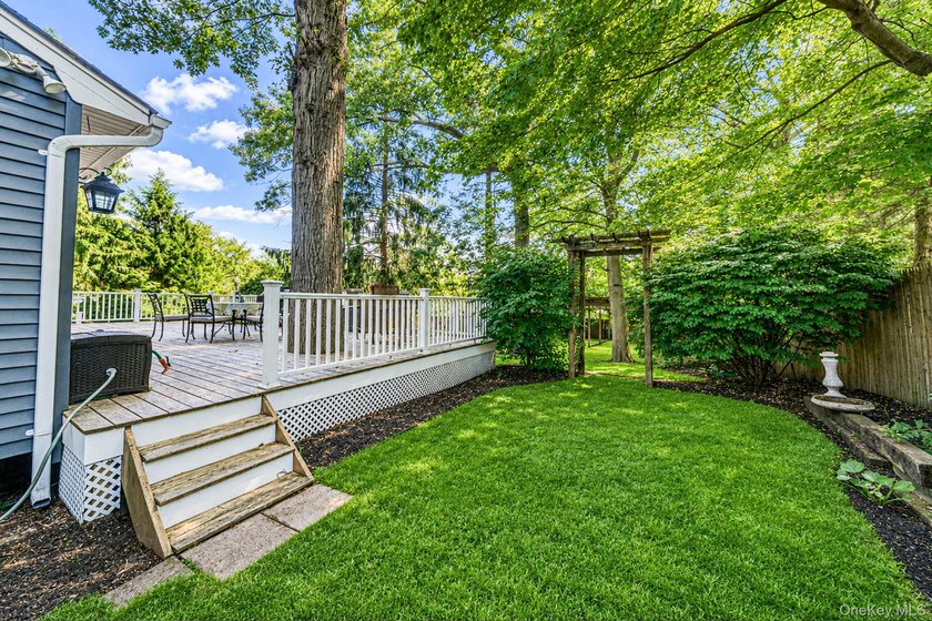 Nestled on a beautifully landscaped property surrounded by - photo 29