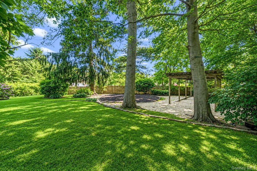 Nestled on a beautifully landscaped property surrounded by - photo 30