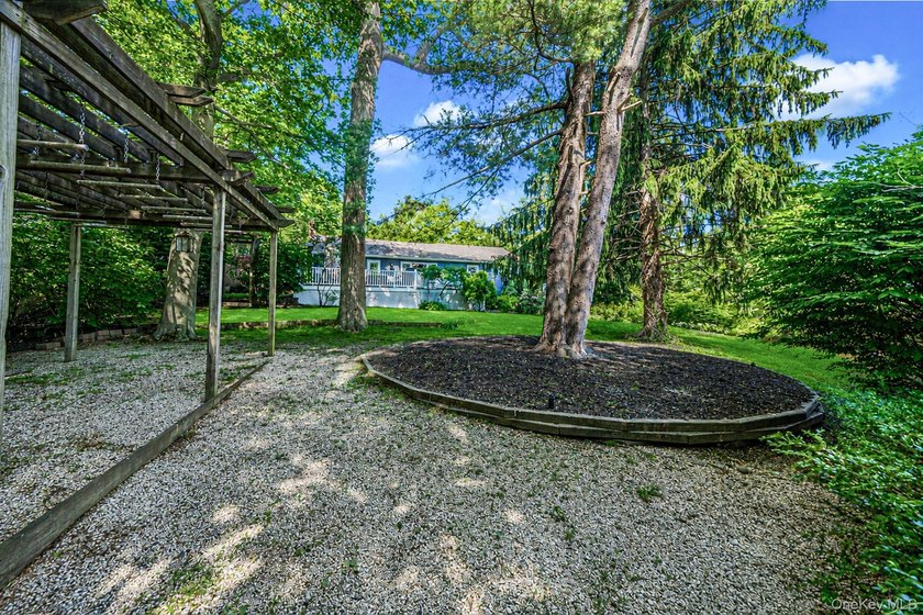 Nestled on a beautifully landscaped property surrounded by - photo 32