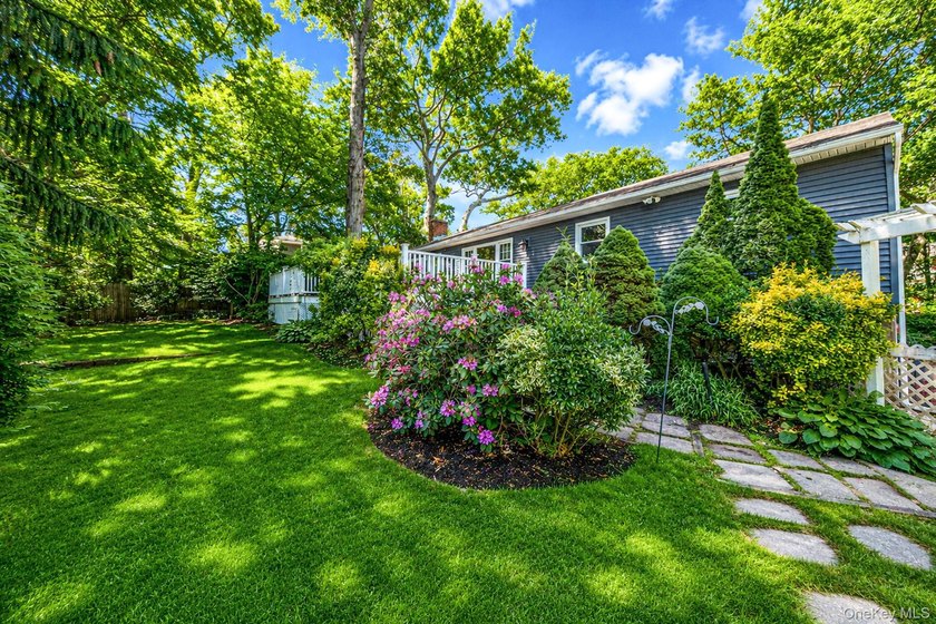 Nestled on a beautifully landscaped property surrounded by - photo 33