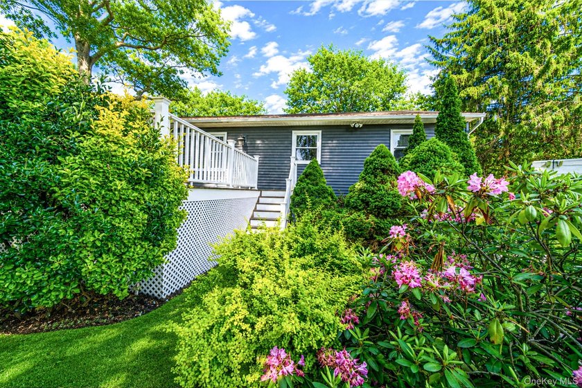 Nestled on a beautifully landscaped property surrounded by - photo 34