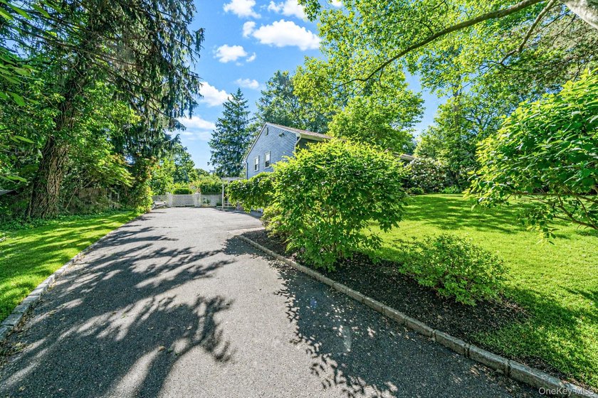 Nestled on a beautifully landscaped property surrounded by - photo 37