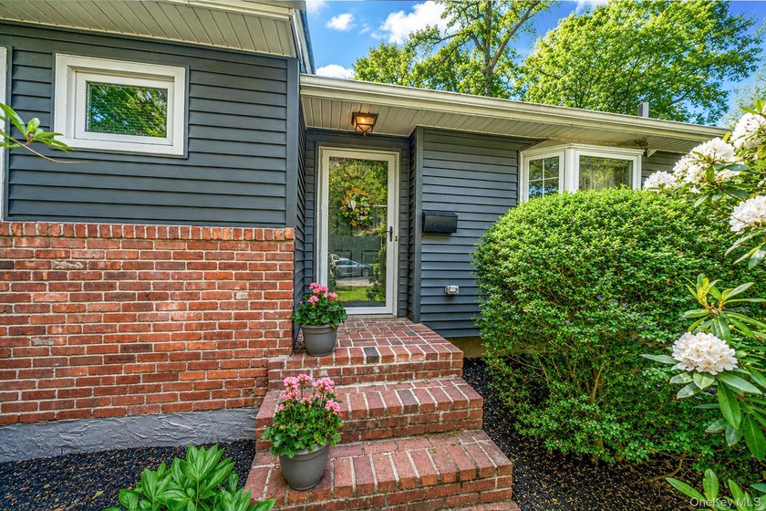 Nestled on a beautifully landscaped property surrounded by - photo 38