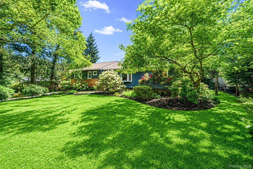 Nestled on a beautifully landscaped property surrounded by - photo 39