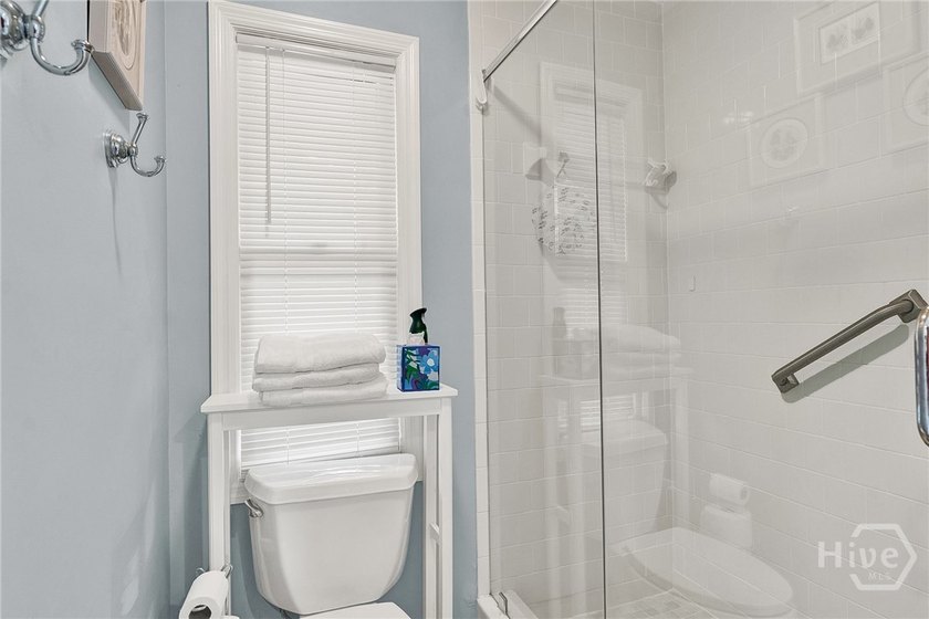 This exceptionally updated, one-level end unit on the lagoon is - photo 26