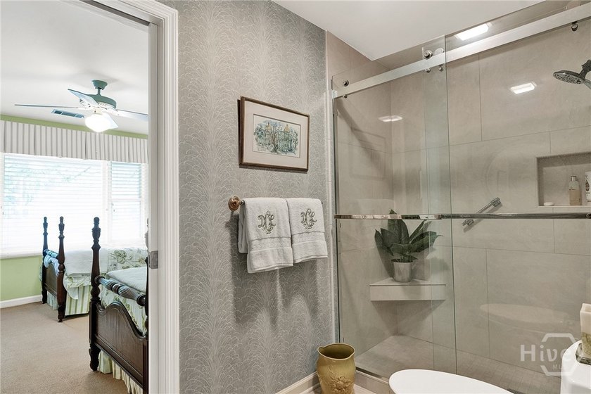 This exceptionally updated, one-level end unit on the lagoon is - photo 29