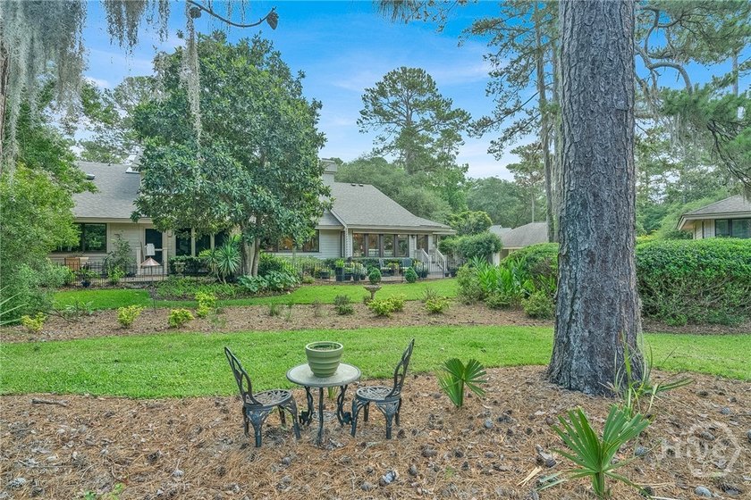 This exceptionally updated, one-level end unit on the lagoon is - photo 35