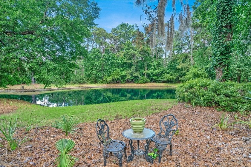 This exceptionally updated, one-level end unit on the lagoon is - photo 37