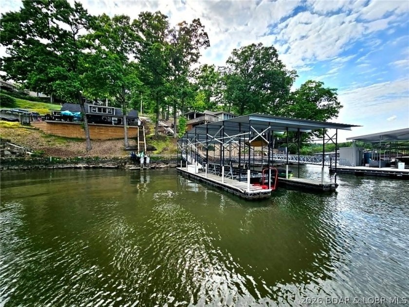 Beautifully positioned near the water's edge, this fully - photo 12