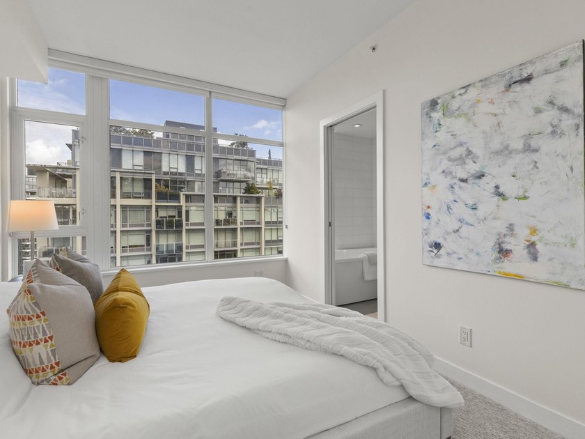 Perched on the coveted NW comer of the sub-penthouse level, this - photo 26