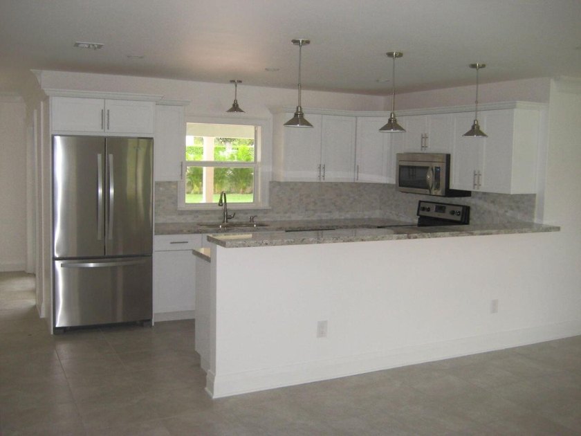 Welcome to this single-story residence in Boca Madera, located - photo 9