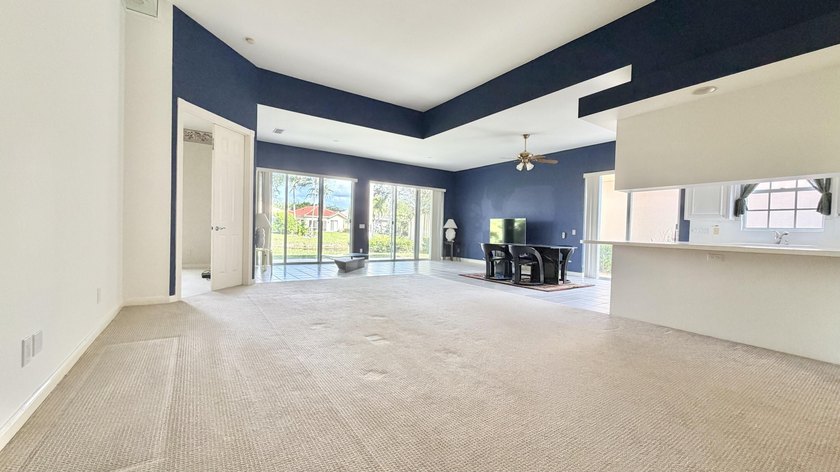 This well-designed home features 12-foot ceilings in the great - photo 2
