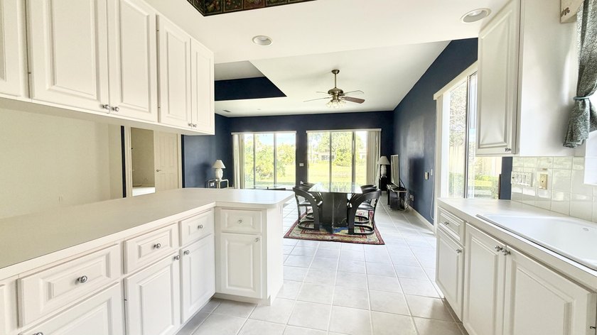 This well-designed home features 12-foot ceilings in the great - photo 5