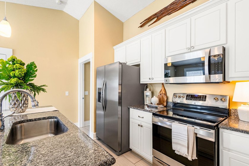This well-located 3-bedroom, 2-bathroom home on the highly - photo 15