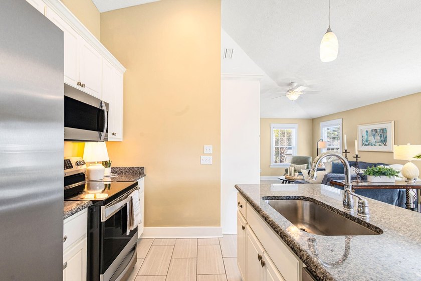 This well-located 3-bedroom, 2-bathroom home on the highly - photo 17