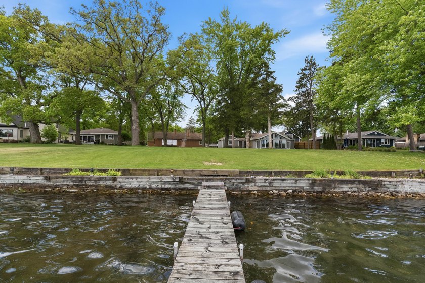 65 ft of level frontage on beautiful Pretty Lake with sunrise - photo 9