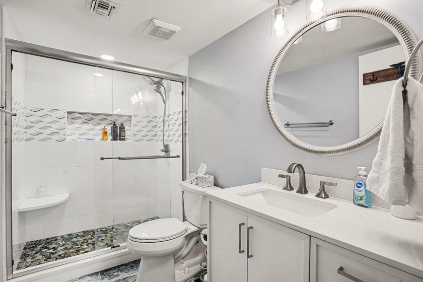 Just a short walk to the beach, this updated second-floor condo - photo 25