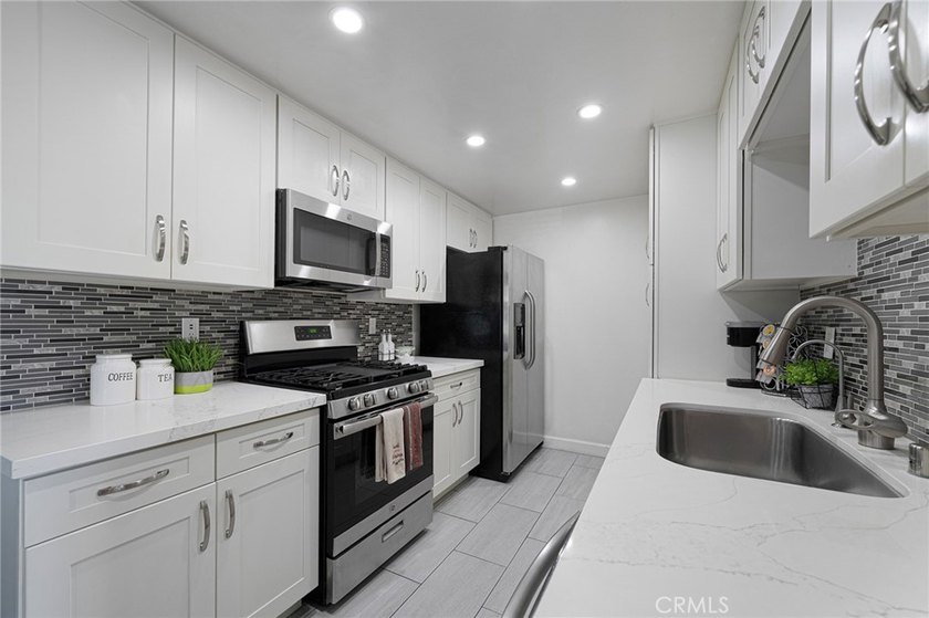 Welcome to Unit #6 updated upstairs condo in the heart of - photo 13