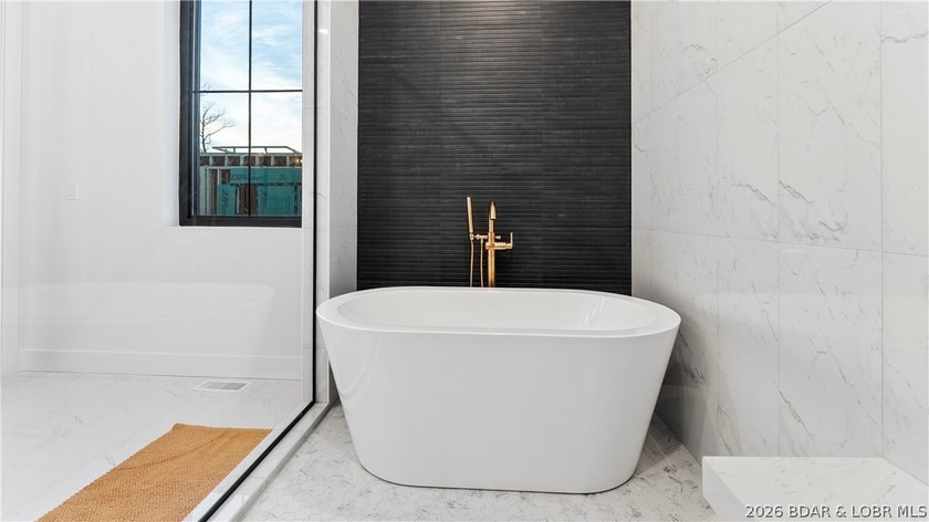 Recently completed by Thomas Construction, this luxury residence - photo 16