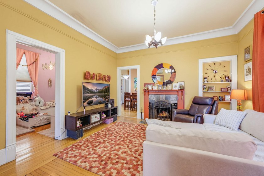 This historic duplex was designed and built in 1893 by the - photo 6