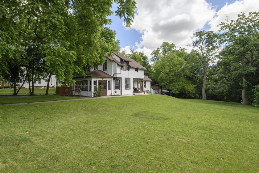 This stunning home is located on a hill overlooking Pewaukee - photo 2