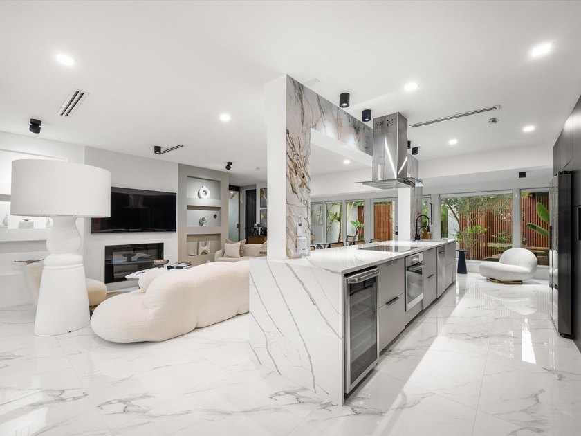 LUXURY updated 4 bedroom/3 bathroom SMART home in Coral Ridge - photo 11