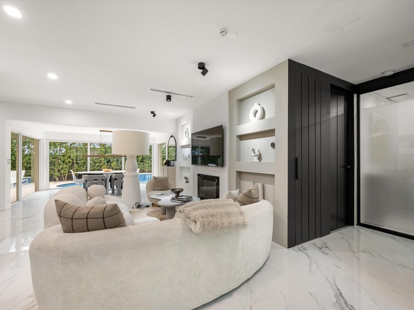 LUXURY updated 4 bedroom/3 bathroom SMART home in Coral Ridge - photo 12