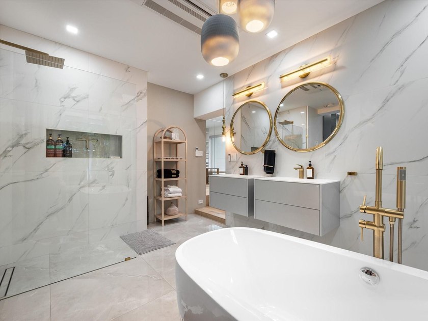 LUXURY updated 4 bedroom/3 bathroom SMART home in Coral Ridge - photo 19