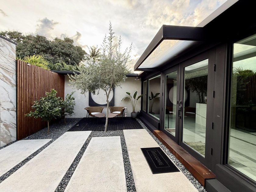 LUXURY updated 4 bedroom/3 bathroom SMART home in Coral Ridge - photo 29