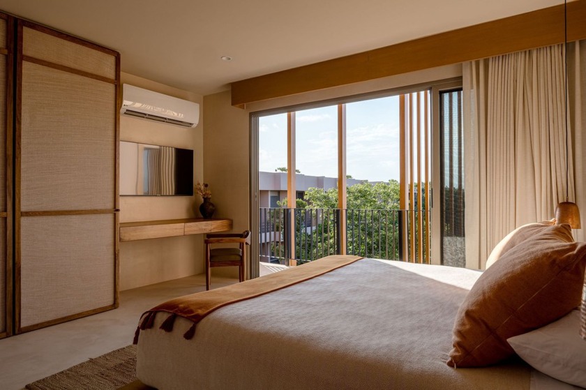 Tucked away in the lush embrace of Aldea Zama, Aflora is more - photo 8