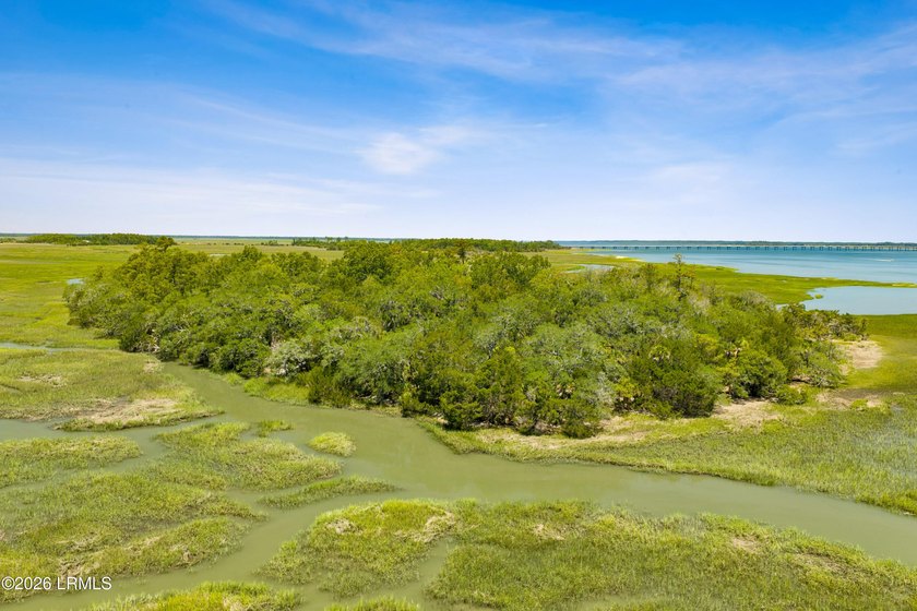 Discover an extraordinary 8-acre private island paradise, where - photo 14