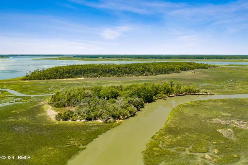 Discover an extraordinary 8-acre private island paradise, where - photo 21