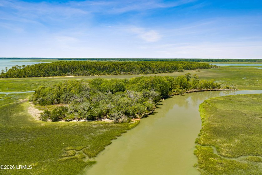 Discover an extraordinary 8-acre private island paradise, where - photo 22
