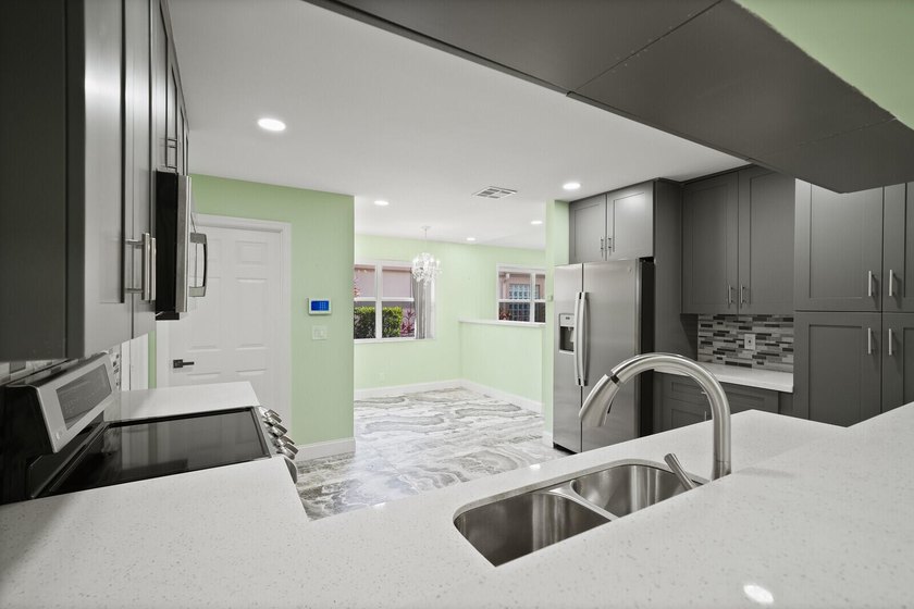 Discover this beautifully renovated 3-bedroom, 2-bath residence - photo 22